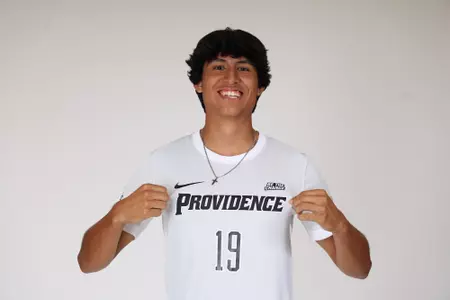Gabriel Solis holding jersey and facing forward 