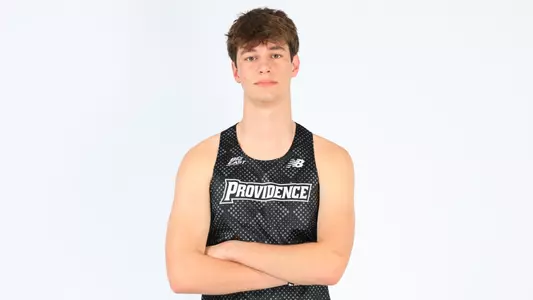 Andrew Condon posing with his arms crossed during a photo shoot
