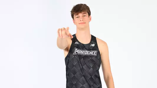 Andrew Condon pointing to the camera during a photo shoot