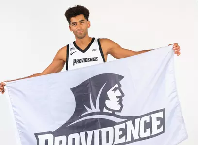Leonardo Marangon with a Providence flag during photo shoot.