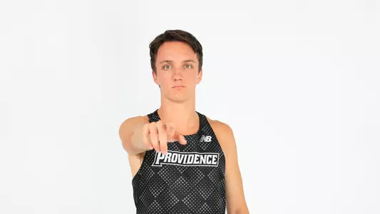 Adam Wedlake pointing to the camera during a photo shoot