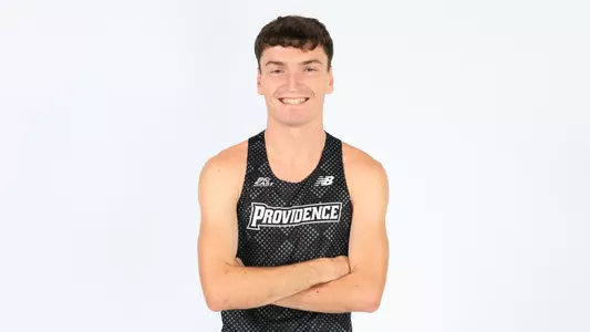 Cormac Dixon posing with his arms crossed during a photo shoot