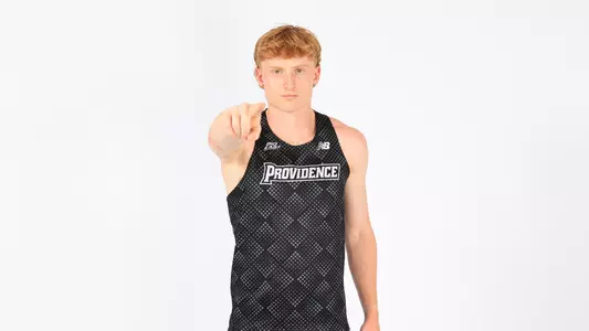 Oliver Neate pointing to the camera during a photo shoot