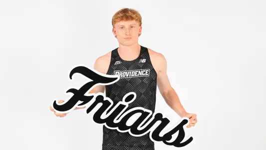 Oliver Neate holding the Friars sign while at a photo shoot