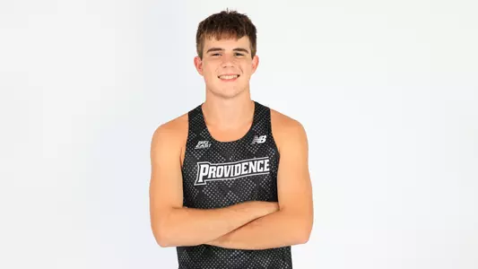 Dylan McCarthy posing with his arms crossed during a photo shoot
