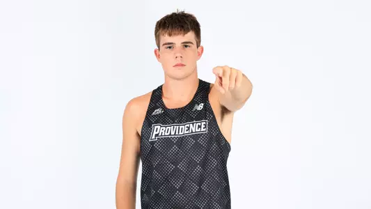 Dylan McCarthy pointing towards the camera during a photo shoot