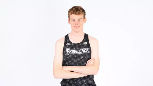 Liam McCay posing with his arms crossed during a photo shoot 