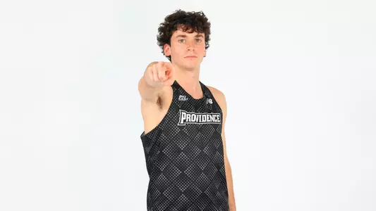 Elliott Pugh pointing to the camera during a photo shoot