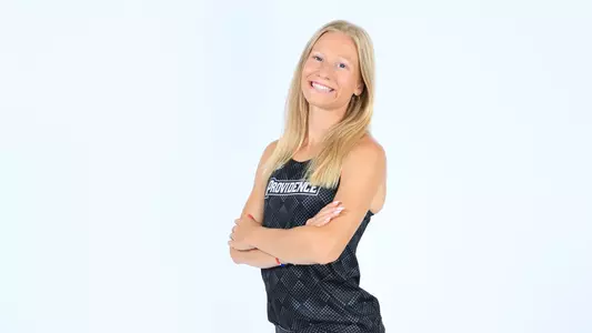 Anna Weirich posing with her arms crossed during a photo shoot 