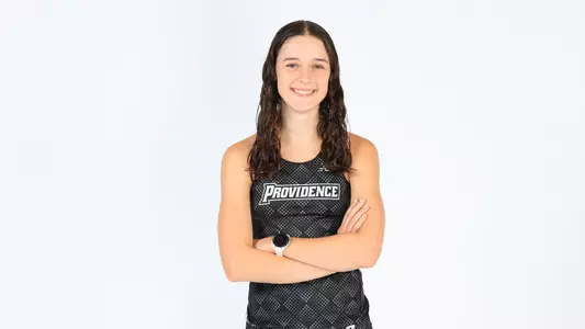 Ciara Evans posing with her arms crossed during a photo shoot 