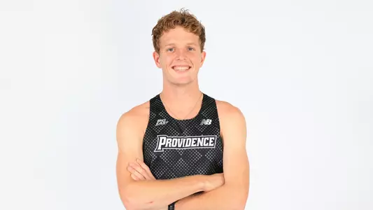 Ryan Welch posing with his arms crossed during a photo shoot 