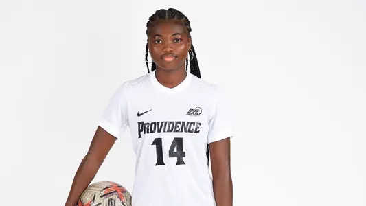 Jocy Koffi Holding Ball Posing