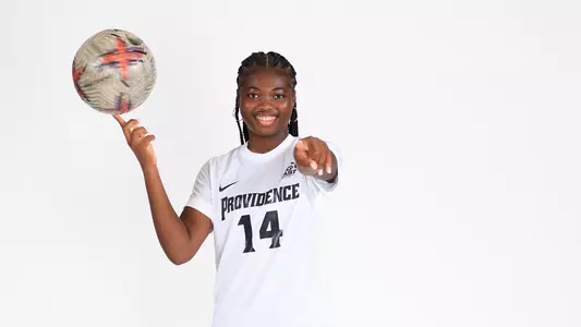 Jocy Koffi Spinning Ball on Finger Posing