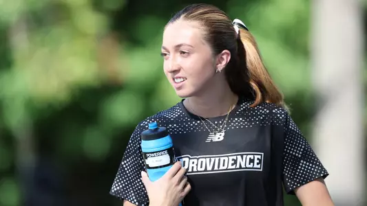 Lucia West warming up for Friar Invitational 
