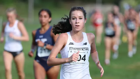 Maggie Slattery racing at Friar invitational 
