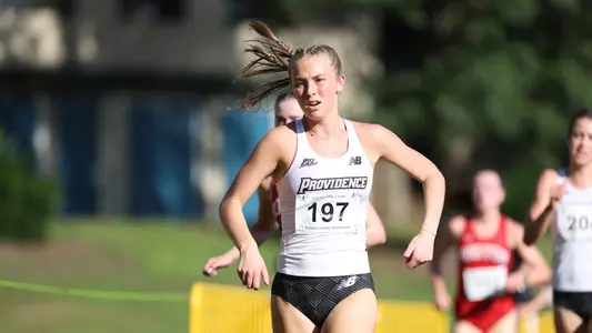 Kaleigh Higgins racing at Friar invitational 