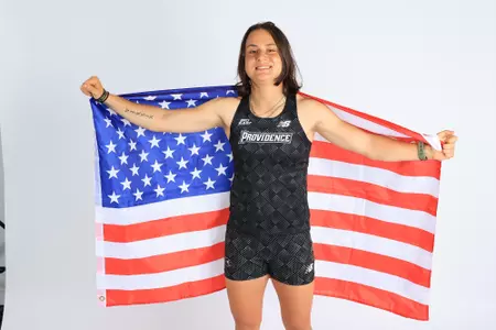 Jenna Jacobs posing with the US flag on media day