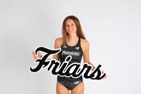 Maggie Kemper posing with the friar sign on media day