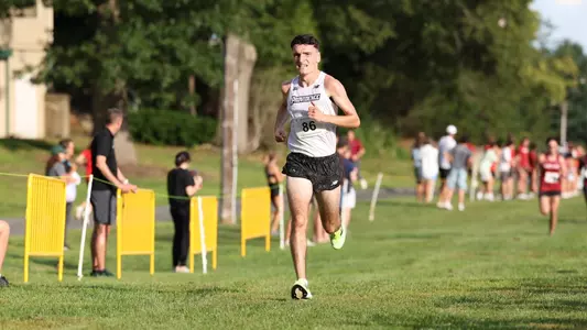 Men's cross country runner Cormac Dixon running at the Friar Invitational