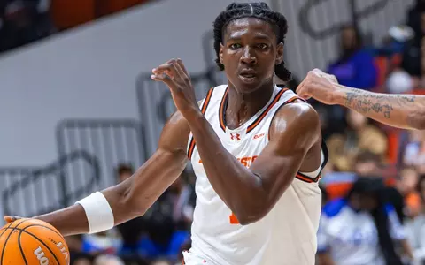 CJ Beaumont dribbles against FIU at Johnson Coliseum