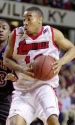 Carlos Hurt looks for an open teammate as he drives past Tennessee Tech's Cameron Crisp in the first half Monday.