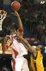Kendall Dartez is fouled by Murray State's Adam Chiles as he goes for a dunk in Saturday's 91-69 win.