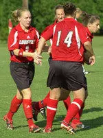 Sophmore Jamie Craft(left) is congratulated by her teammates after scoring the second of her three goals in U of L's 5-3 win over Murray State Tuesday.(Photo courtesy of Michael Dann)