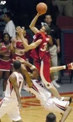 Houston forward  Ramon Dyer takes a charge by Louisville's Francisco Garcia in the waning seconds.