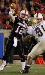 Brian Brohm throws from the pocket as one of his offensive linemen blocks Pittsburgh's Phil Tillman during the first half.