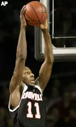 Brandon Jenkins soars toward the basket for a dunk during the first half. (AP Photo\Ed Reinke)