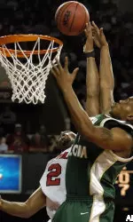 Ellis Myles gets the tip over the defense of South Florida's Marlyn Bryant during action of their game Saturday