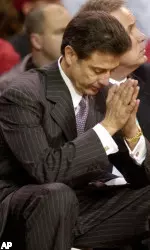 Coach Rick Pitino clasps his hands in the closing minutes of his team's game against Memphis Wednesday, Feb. 9, 2005, in Louisville, Ky.