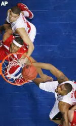 Francisco Garcia, Louisiana-Lafayette's Dwayne Mitchell and Ellis Myles watch the ball as it comes off the rim during the first half in the first round of the NCAA tournament. (AP Photo/John Russell)