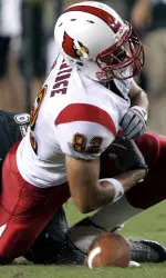 Gary Barnidge fumbles the football after a hit from South Florida's Ben Moffitt.