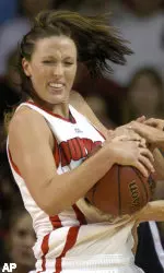 Louisville's Katie Olson, left, battles Connecticut's Nicole Wolff for a loose ball. (AP Photo/Timothy D. Easley)