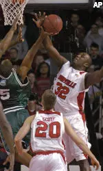 Derrick Caracter (32) goes up to block the shot of Ohio's Leon Williams (5) in the first half. (AP Photo/Timothy D. Easley)