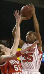 Angel McCoughtry puts a shot up over Western Kentucky's Sarah Shouse during the first half. (AP Photo/Timothy D. Easley)