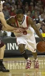 Louisville's Taquan Dean, right, drives past Missouri State's Blake Ahearn during the second half of an NIT basketball tournament quarterfinal Wednesday, March 22, 2006, in Louisville, Ky. Louisville defeated Missouri State 74-56 as Dean led all scorers with 26 points. (AP Photo/Timothy D. Easley)