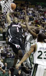 Terrence Williams goes up for a layup in front of South Florida defenders McHugh Mattis (15) and Jesus Verdejo in the first half. (AP Photo/Chris O'Meara)