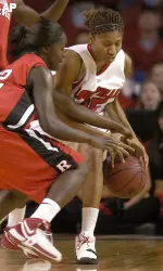 Angel McCaughtry battles with Rutger's Matee Ajavon for the ball during second half action Sunday. (AP Photo/Timothy D. Easley)