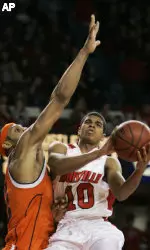Louisville's Edgar Sosa goes to the basket past Syracuse's Darryl Watkins in the second half. (AP Photo/Ed Reinke)