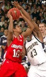 Edgar Sosa drives the lane as Notre Dame guard Russell Carter defends during first half.