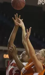 Chauntise Wright - who posted a career-best game with 25 points and 12 rebounds - is fouled by Syracuse's Vaida Sipaviciute during the second half. (AP Photo/Timothy D. Easley)
