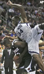 Juan Palacios draws a foul on Villanova's Curtis Sumpter in the first half. (AP Photo/Rusty Kennedy)