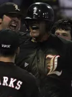 The Cardinals greet Chris Dominguez at the plate after his two-run home run put them on top in the eighth.