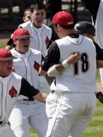 Trystan Magnuson is mobbed by his teammates after the Cards won the 2007 Columbia Regional with a 16-6 win Monday.