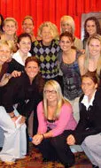 Members of the softball team with keynote speaker Sue Enquist (center)