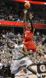 Terrence Williams shoots over Georgetown's Jessie Sapp during the first half. (AP Photo/Nick Wass)