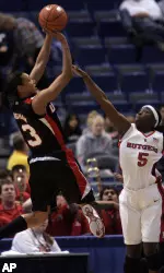 Candyce Bingham goes high in the air as Rutgers' Essence Carson tries to block her shot. (AP Photo/Bob Child)