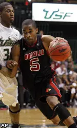 Chris Smith drives past South Florida's Hugh Robertson
